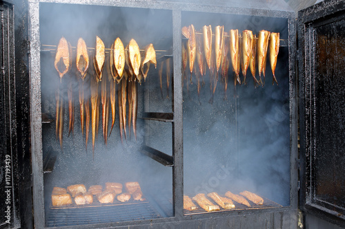 Golden smoked fish in a smoker