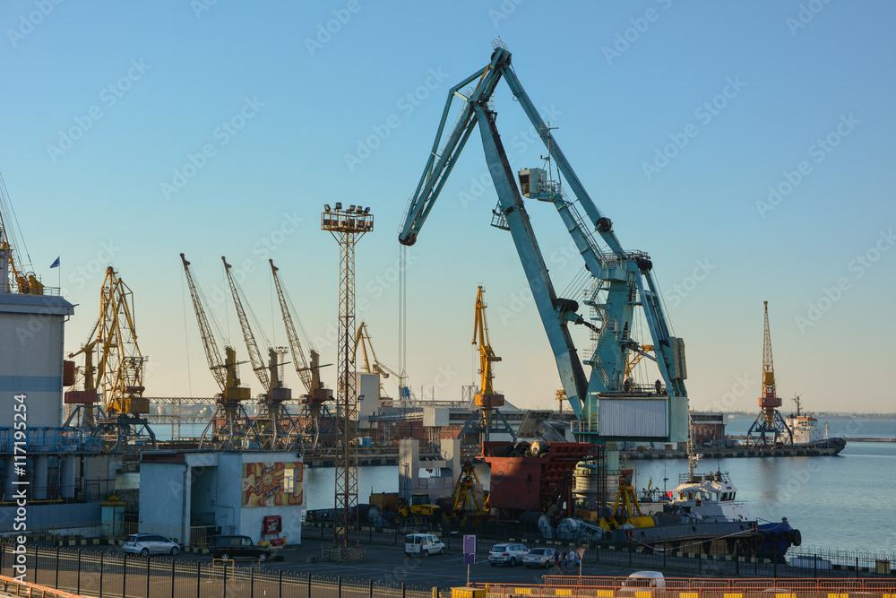 Dockside cranes on a background of blue sky
