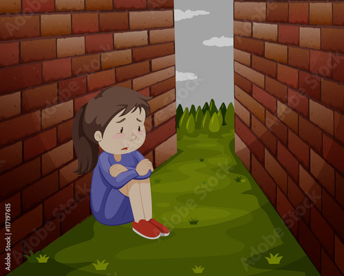 Sad girl sitting on the ground