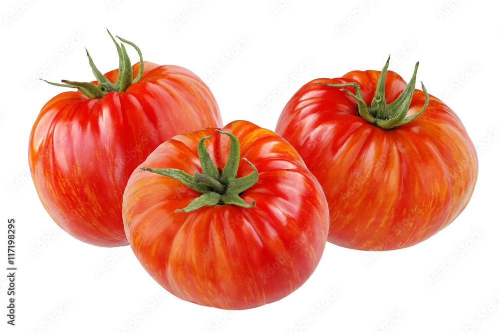 Ripe red tomatoes with orange stripes isolated on white. Ripe red tomatoes with orange stripes isolated on white.