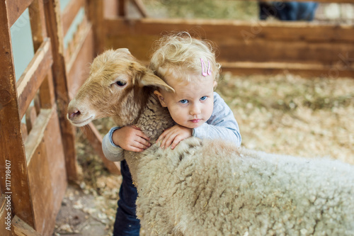 Girl hugging lamb