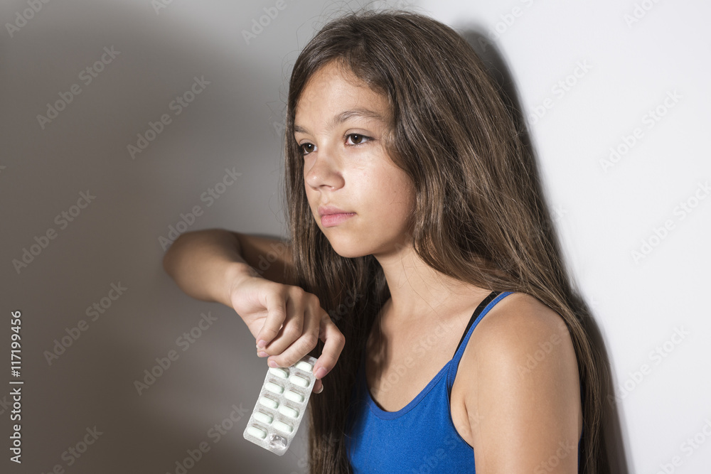 Depressed teenager with pills Depressed teenager with pills