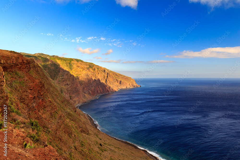 Beautiful Madeira landscape with azure water and green cliffs, Portugal