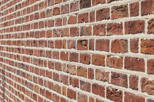 Typical wall with red bricks.