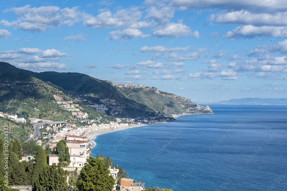 Panoramic view of the Taormina Mediterranean coastline, Province of Messina. Sicily, Italy.