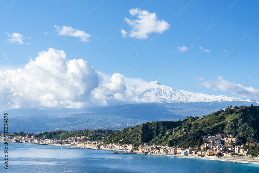 Giardini Naxos and Mount Etna. View from Taormina. Province of Messina. Sicily, Italy.