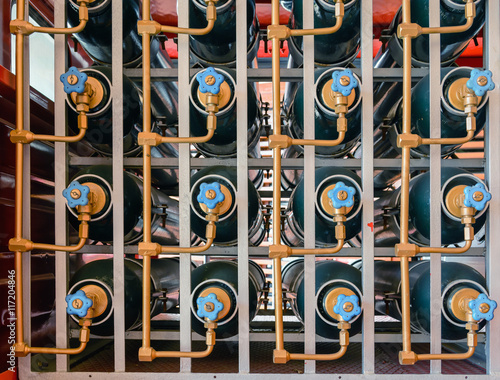 plurality of cylinders of carbon dioxide to extinguish fire. Valves and piping.