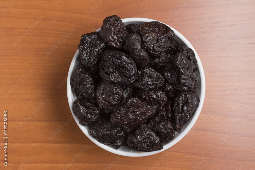 Prunes into a bowl Prunes into a bowl