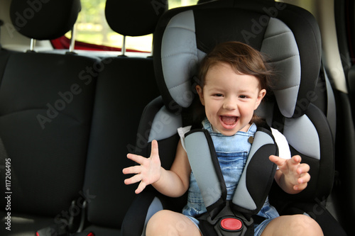 Boy sitting in a car in saf...