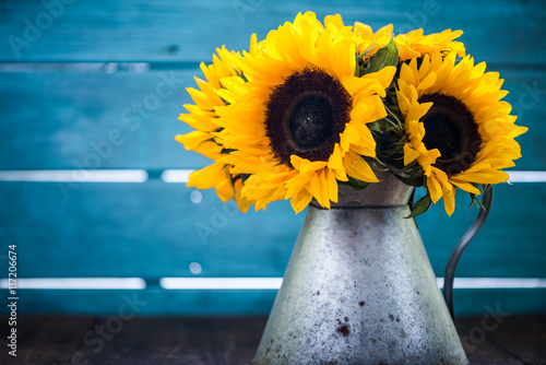 Fototapeta Naklejka Na Ścianę i Meble -  sunflowers bouquet in vintage vase