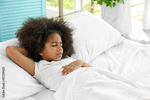 Cute African girl in bed