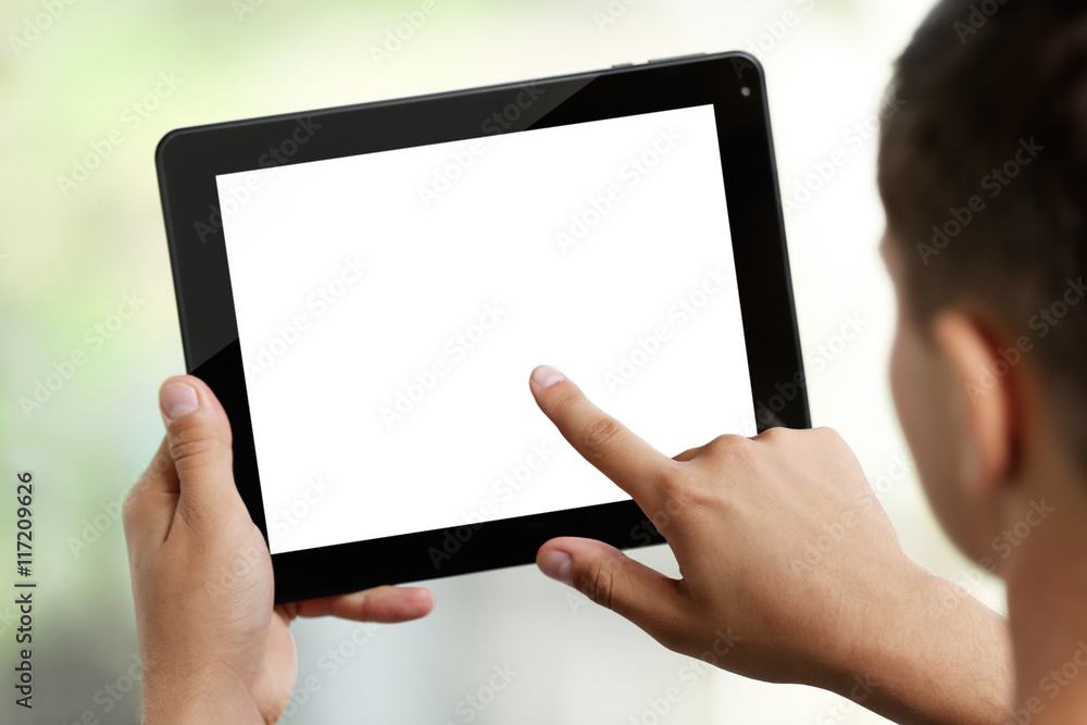 Young man with gadget on blurred background Young man with gadget on blurred background