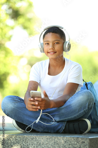 African American boy listen...