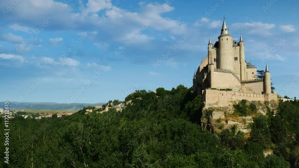 Middle age castle, romantic medieval fortress with perfect evening colored sunset light and beautiful clouds. The spanish castle Alcazar of Segovia, in Castilla y Leon, Spain Middle age castle, romantic medieval fortress with perfect evening colored sunset light and beautiful clouds. The spanish castle Alcazar of Segovia, in Castilla y Leon, Spain