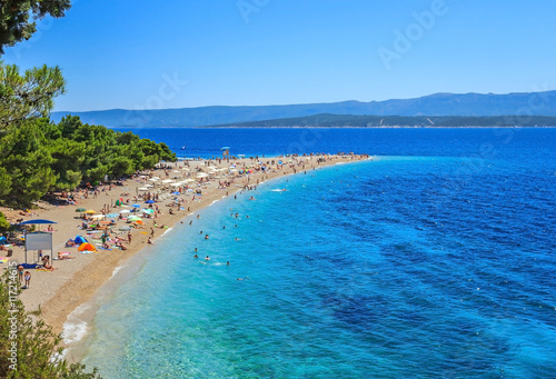 View of packed Bol beach on Brac island of Croatia in summer