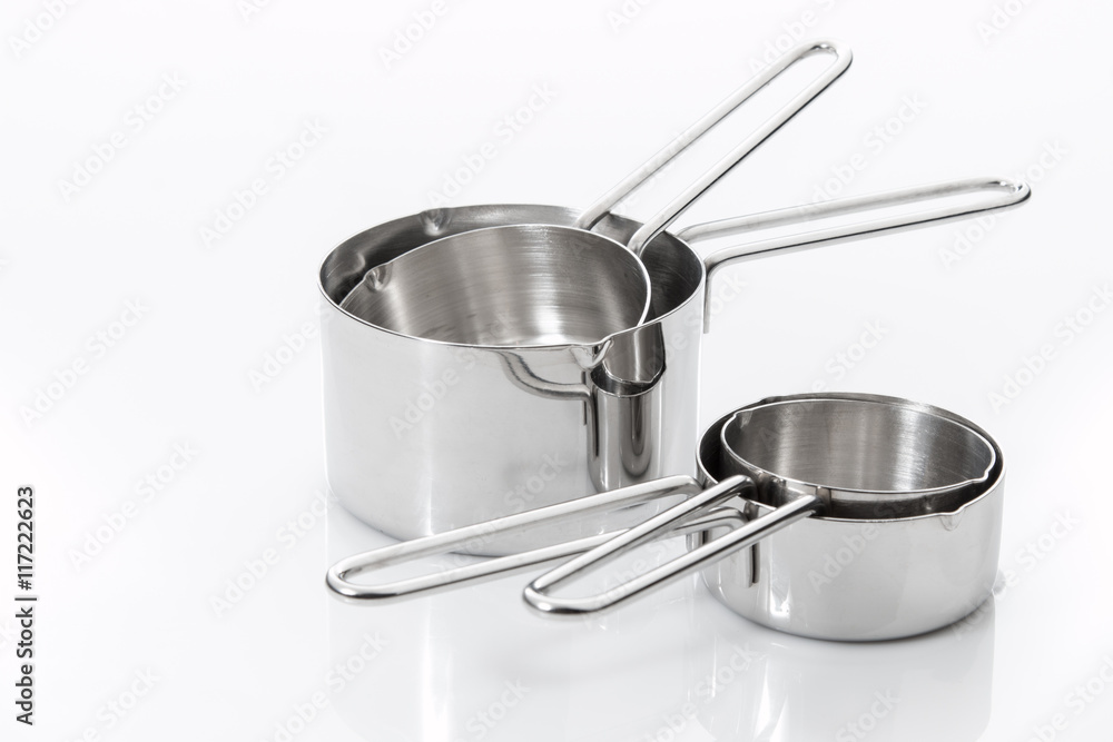Measuring cups made of stainless steel on white Measuring cups made of stainless steel on white