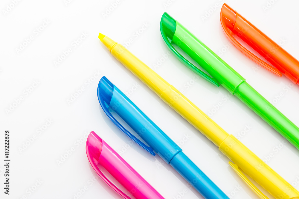 Multi color highlighters on white background Multi color highlighters on white background