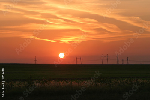 Power lines against the background of a beautiful sunset