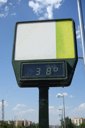 detail of high temperature on the bridge. A thermometer with no advertisement showing 38 degrees on a street
