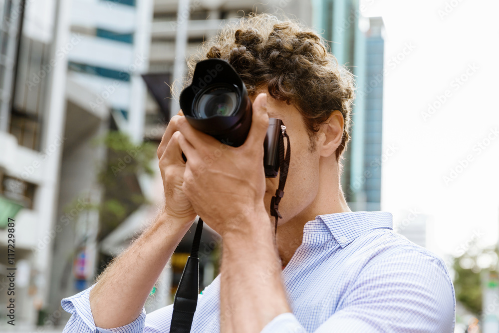 Male photographer taking picture