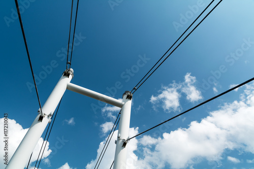 bridge support with metal wire rope on the sky background