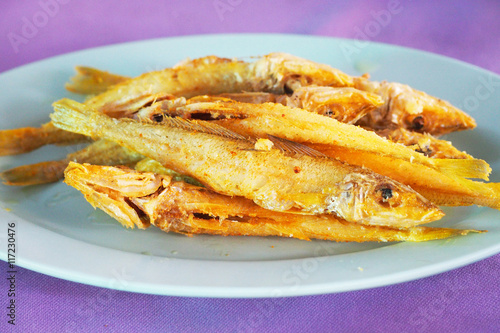 Deep fried fish with fresh turmeric