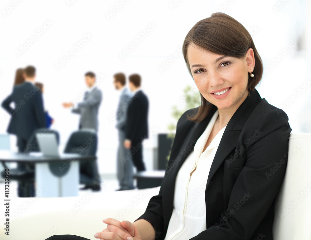 Beautiful business woman with co-wokers at background Beautiful business woman with co-wokers at background