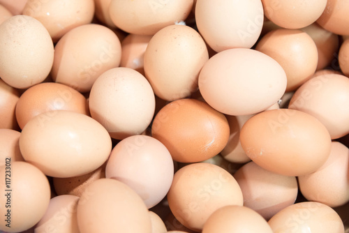 close up pile of fresh chicken eggs in the market