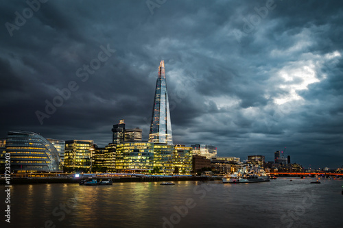 Gloomy sunset over the skyline of London and the river Thames, England, UK © Victor Moussa