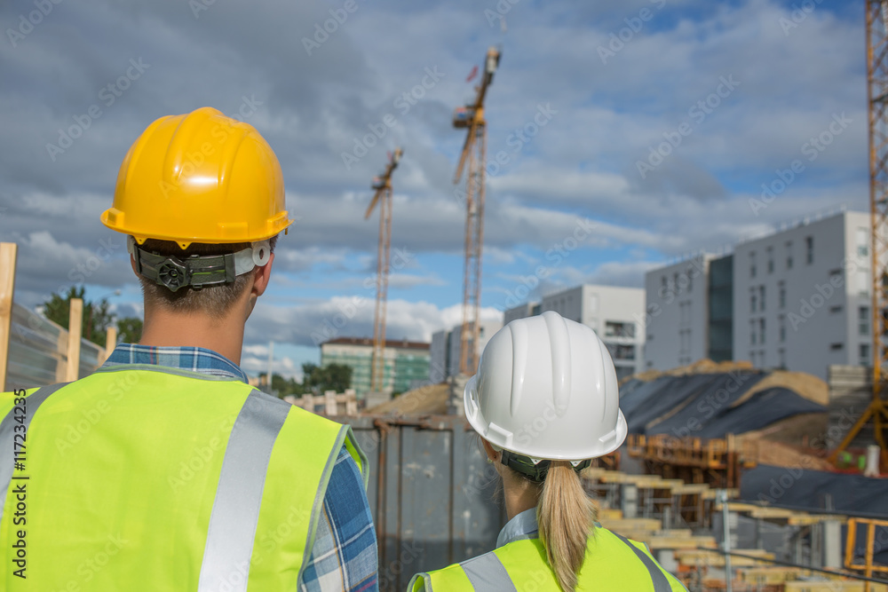 business, building, paperwork and people concept - builder in hardhat with tablett outdoors business, building, paperwork and people concept - builder in hardhat with tablett outdoors