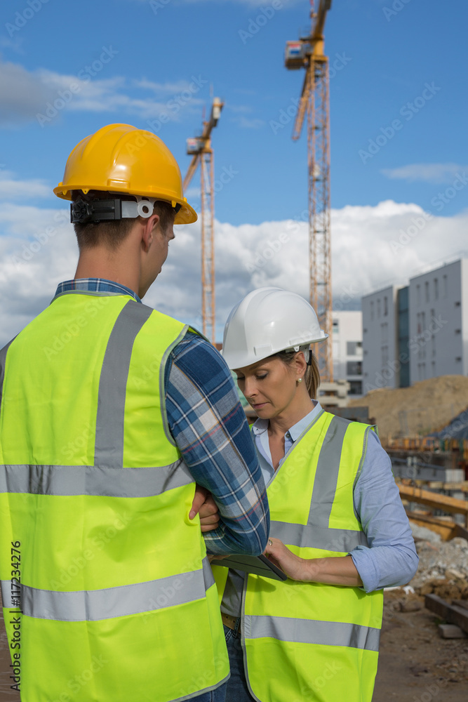 Female engineer and foreman working together Female engineer and foreman working together