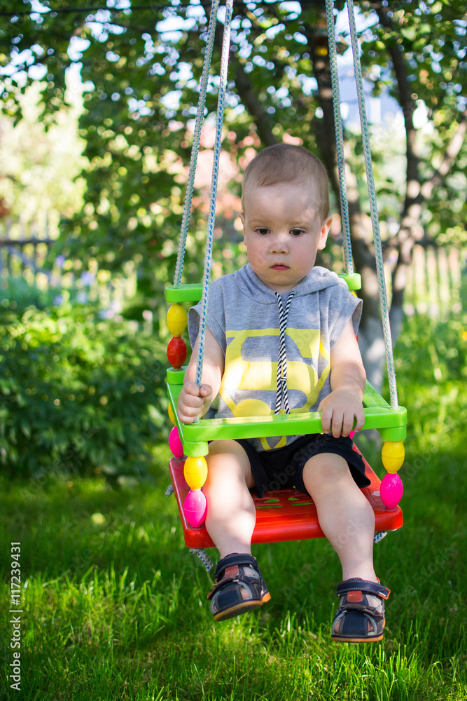 Boy goes for a drive on  swing