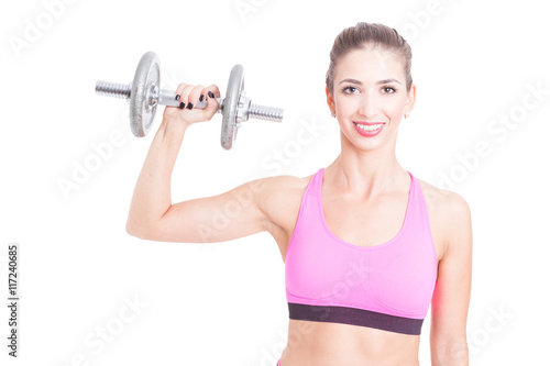 Female trainer holding up one heavy dumbbell