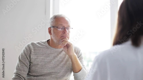 Wallpaper Mural senior man and doctor meeting at hospital 39 Torontodigital.ca
