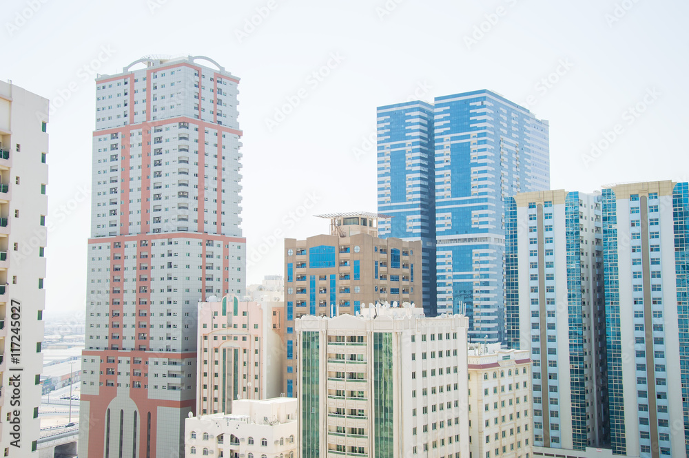 Residential area in Sharjah, United Arab Emirates. Skyscarapers Residential area in Sharjah, United Arab Emirates. Skyscarapers