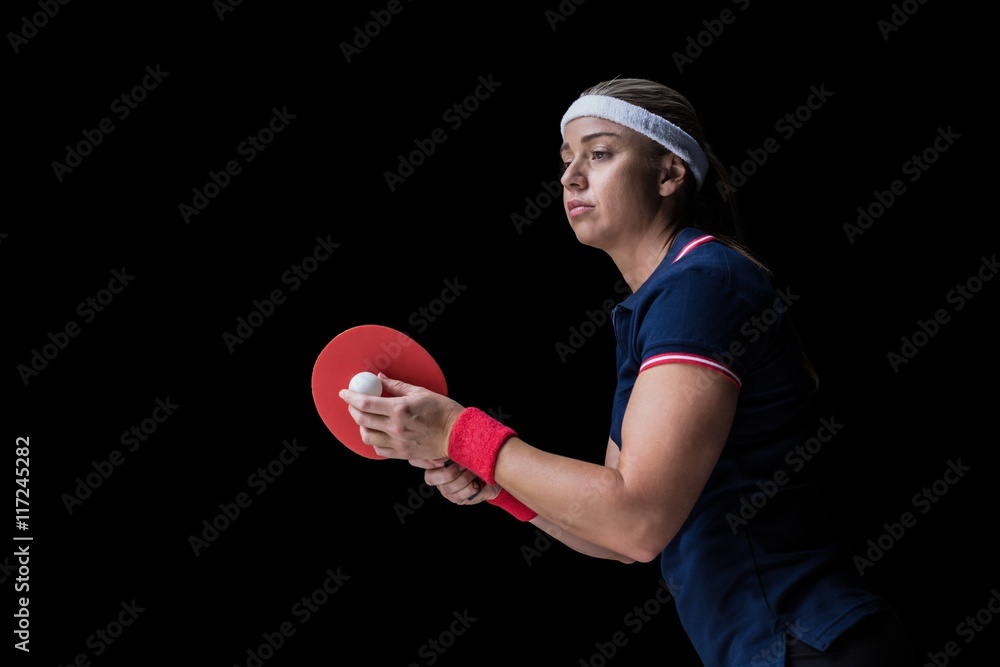 Female athlete playing ping pong Female athlete playing ping pong
