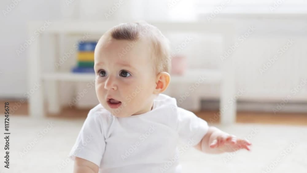 happy little baby sitting in living room at home 12 happy little baby sitting in living room at home 12