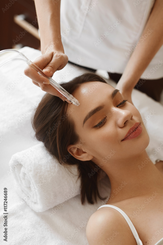 Facial Beauty Treatment. Woman Getting Oxygen Water Skin Peeling Facial Beauty Treatment. Woman Getting Oxygen Water Skin Peeling
