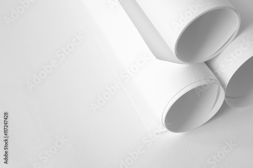 Roll of white papers on white paper with copy space for text at left side,high key tone.