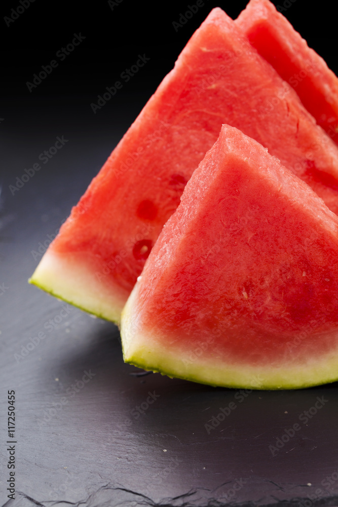 watermelon slices on black slate watermelon slices on black slate