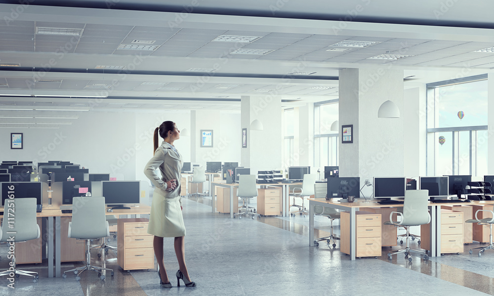 Businesswoman in modern office . Mixed media Businesswoman in modern office . Mixed media