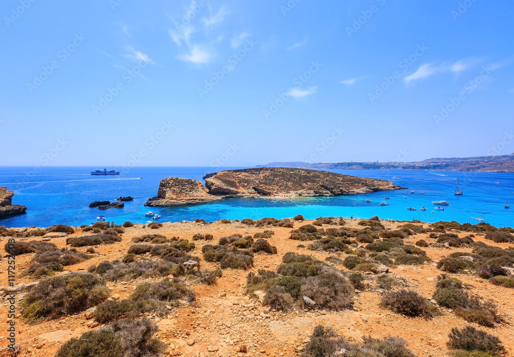 Blue lagoon, famous beach and seafront on Comino island of Malta in mediterranean sea