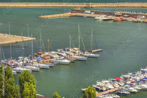 Modern yachts and boats in Touristic Tomis Port at The Black Sea in Constanta, Romania. Tomis port is an important attraction in Constanta city for tourists.
