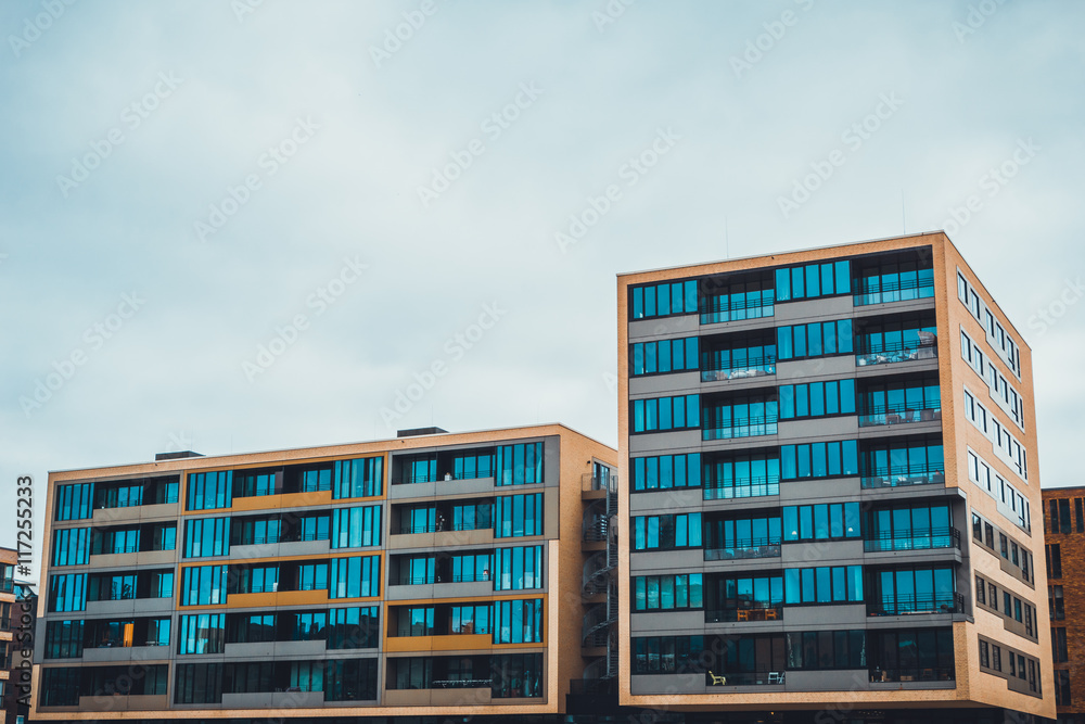 Pair of apartment buildings with large windows