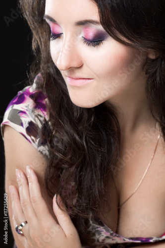 Beautiful attractive woman posing in Studio on black background
