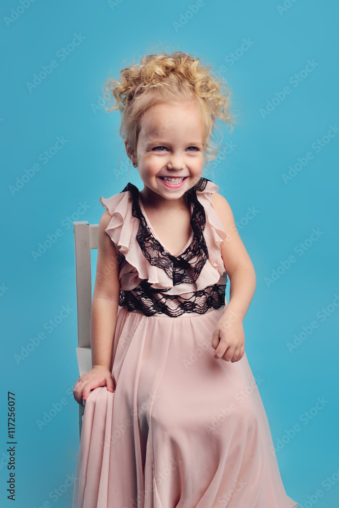 little girl in a long dress and a fur coat little girl in a long dress and a fur coat