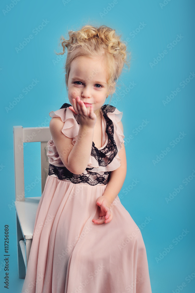 little girl in a long dress and a fur coat little girl in a long dress and a fur coat