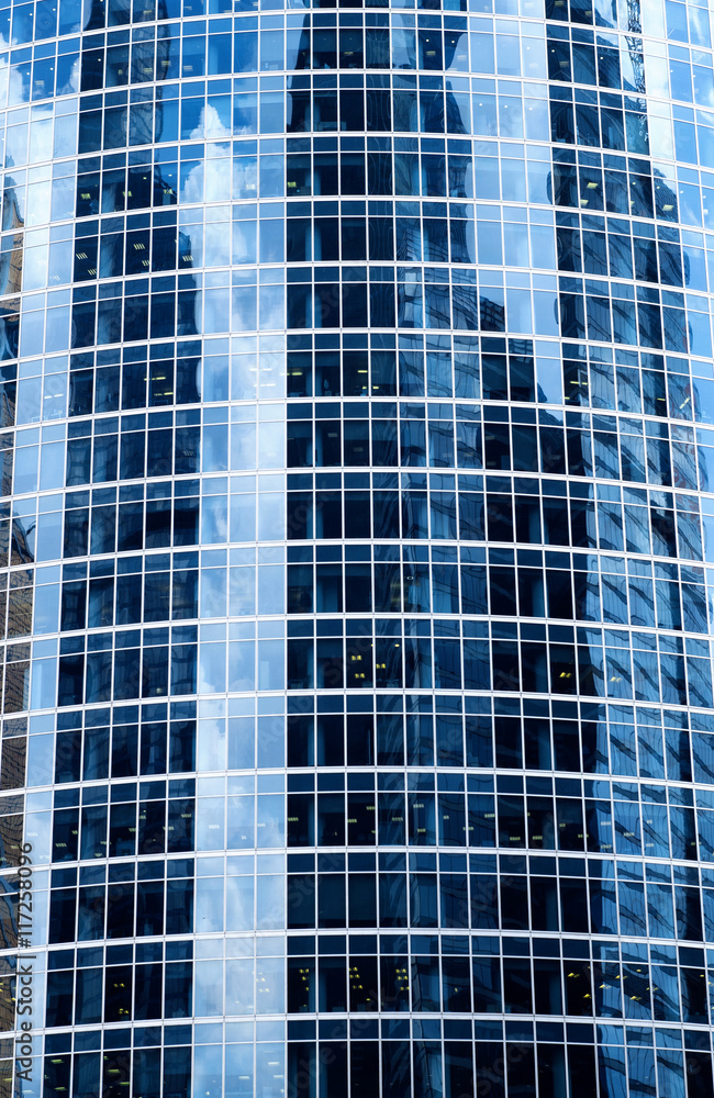 Reflections of clouds in windows of a skyscraper Reflections of clouds in windows of a skyscraper