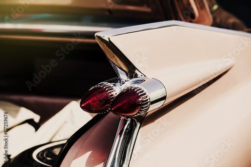 Detail of classic american car. Backlight close up.