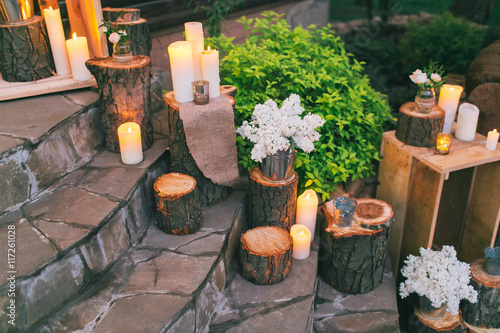 Rustic wedding decor, decorated stairs with sumps and lilac arra